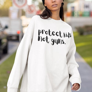 
            
                Load image into Gallery viewer, Protect Kids Not Guns | Unisex Sweatshirt
            
        
