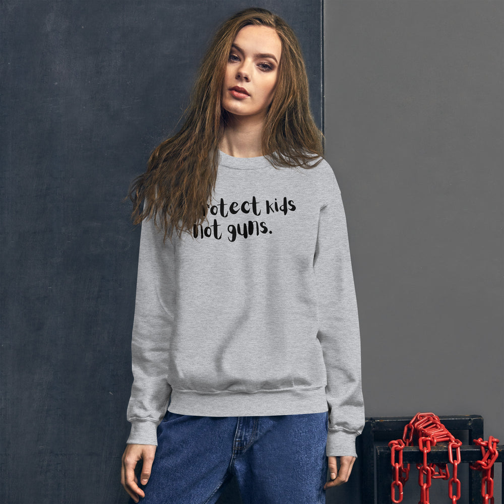
            
                Load image into Gallery viewer, Protect Kids Not Guns | Unisex Sweatshirt
            
        